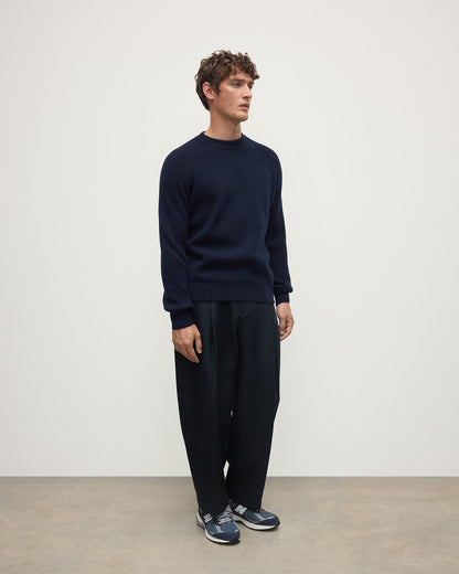 Side view of a model wearing Johnstons of Elgin AW25 Men's Knitwear Dark Navy & Heather Navy Contrast Neck Navy Cashmere Jumper KAA05270Q25362