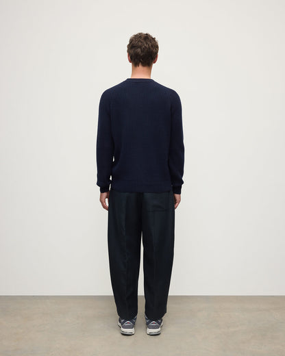 Back view of a model wearing Johnstons of Elgin AW25 Men's Knitwear Dark Navy & Heather Navy Contrast Neck Navy Cashmere Jumper KAA05270Q25362