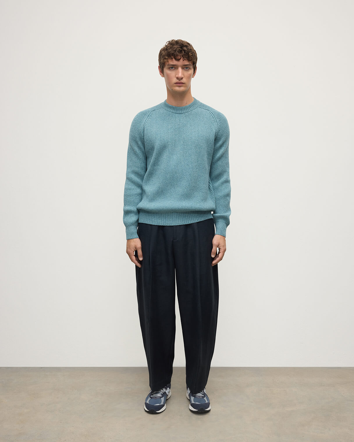 Front view of a model wearing Johnstons of Elgin AW25 Men's Knitwear Seascape & Light Grey Contrast Neck Green Cashmere Jumper KAA05270Q25365