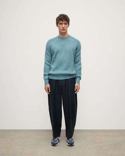 Front view of a model wearing Johnstons of Elgin AW25 Men's Knitwear Seascape & Light Grey Contrast Neck Green Cashmere Jumper KAA05270Q25365