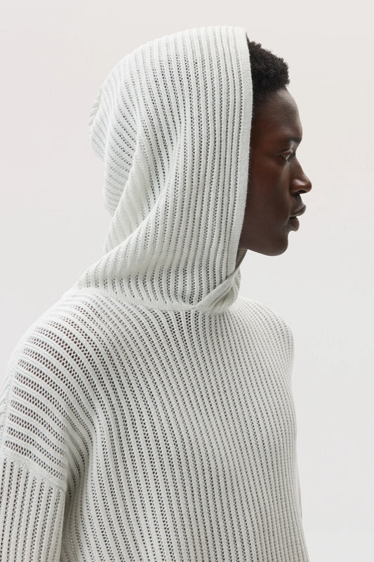 Male model wearing Johnstons of Elgin SS25 Unisex Knitwear White Mesh Rib Cashmere Hoodie on a white background KAA05413HA0346