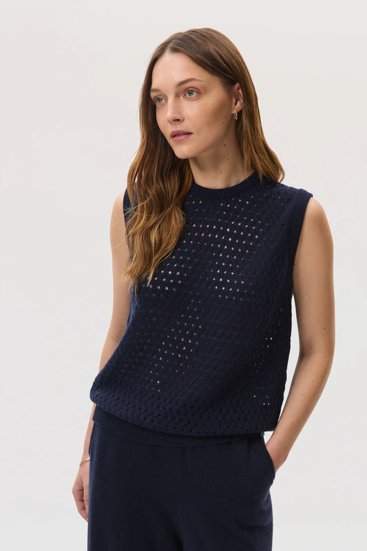 Model wearing Johnstons of Elgin SS25 Women's Knitwear Navy Open Basketweave Cashmere Tank on a white backdrop KAA05429SD7286