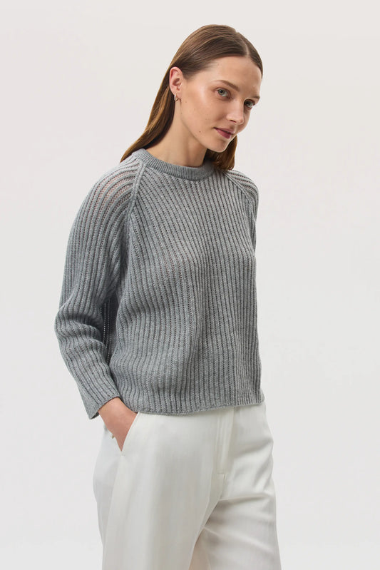 Model wearing Johnstons of Elgin SS25 Women's Knitwear Light Grey Mesh Rib Cashmere Jumper against a white backdrop KAA05430HA0308