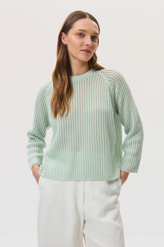 Model wearing Johnstons of Elgin SS25 Women's Knitwear Mint Mesh Rib Cashmere Jumper against a white backdrop KAA05430SC0169