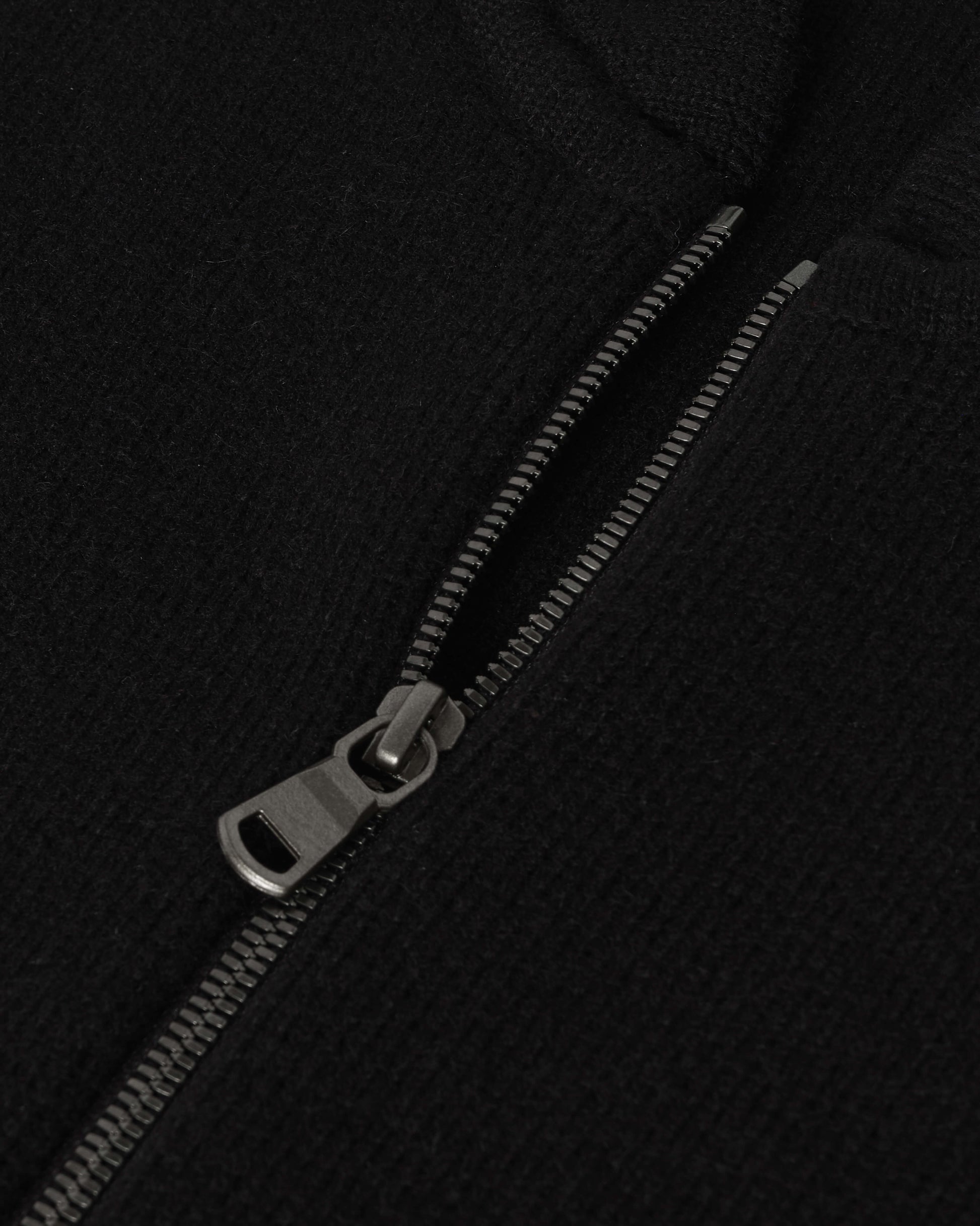 Johnstons of Elgin AW25 Men's Knitwear Black Cashmere Milano Stitch Zip Jacket with black trousers and a white t-shirt  KAA05443SA0900