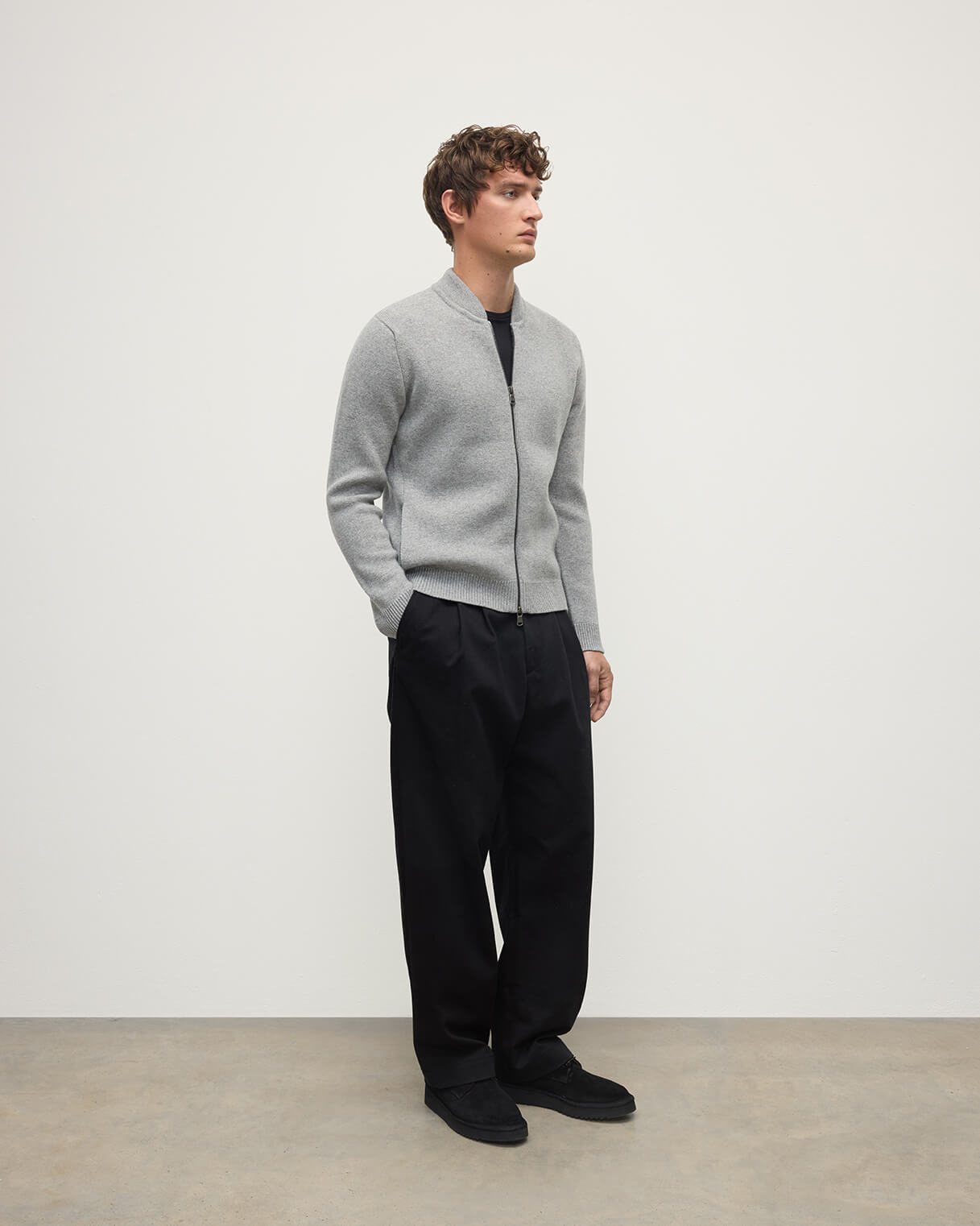 Model wearing Johnstons of Elgin AW25 Men's Knitwear Light Grey Cashmere Milano Stitch Zip Jacket on a white backdrop KAA05443HA0308