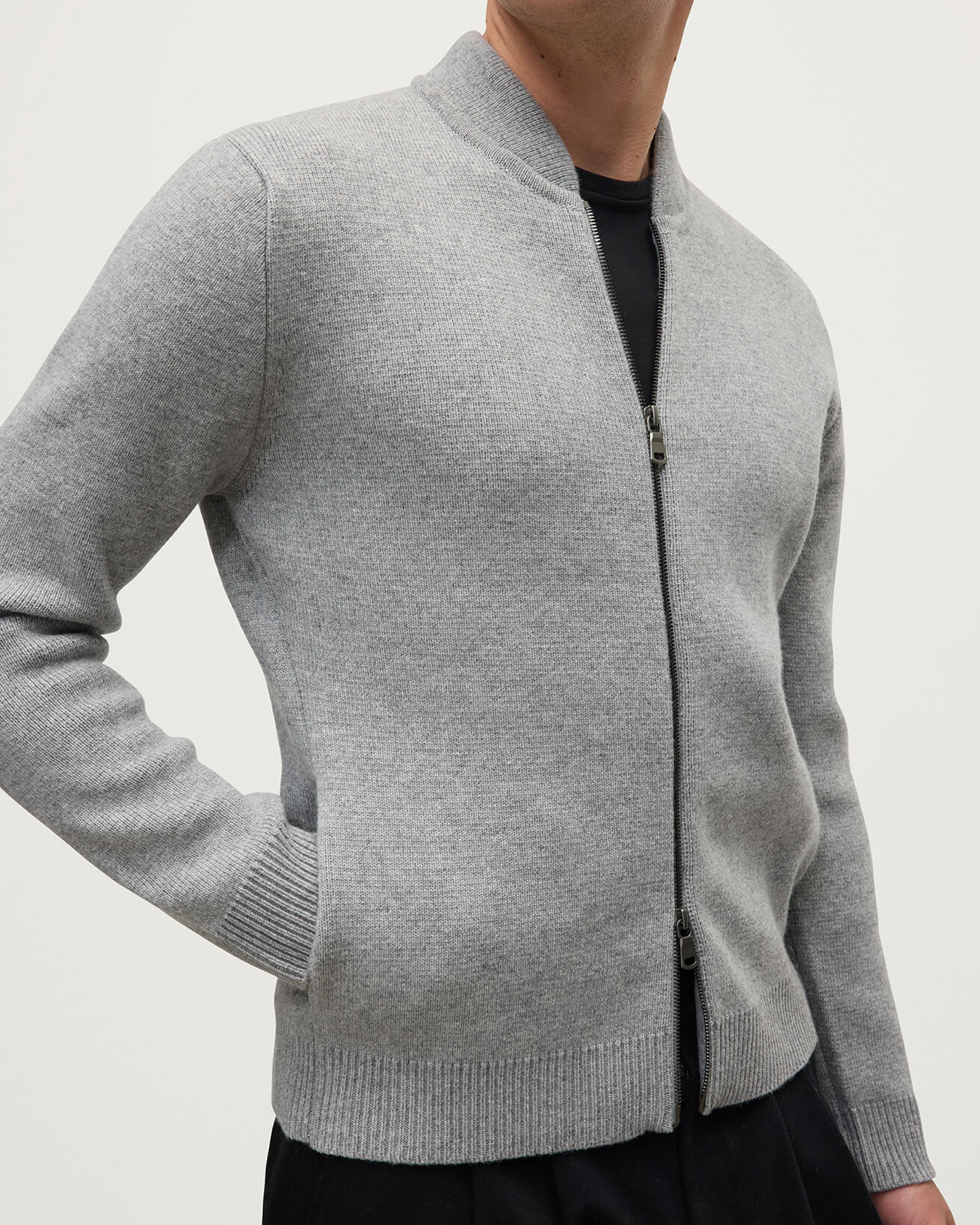 Model wearing Johnstons of Elgin AW25 Men's Knitwear Light Grey Cashmere Milano Stitch Zip Jacket on a white backdrop KAA05443HA0308