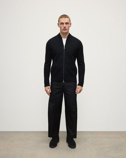 Front view of a model wearing Johnstons of Elgin Men's Knitwear Black Milano Ribbed Zip Black Cashmere  KAA05443SA7210