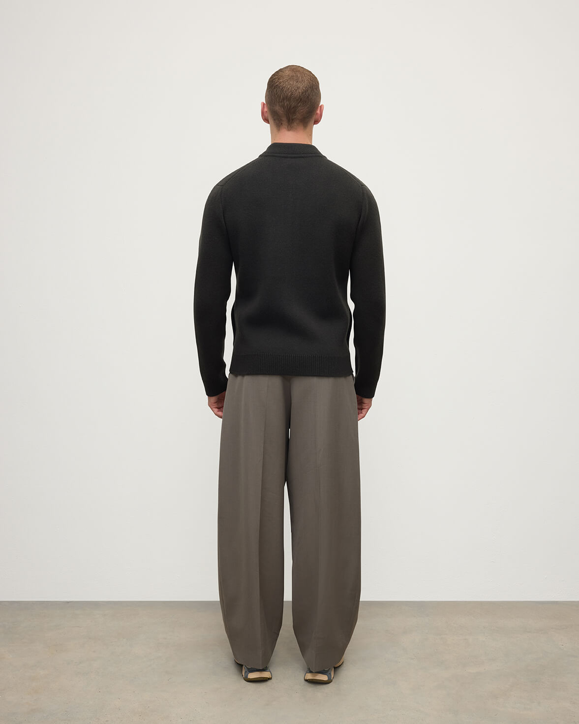 Back view model wearing Johnstons of Elgin AW25 Men's Knitwear Black Milano Ribbed Zip Black Cashmere Cardigan KAA05443SC7330