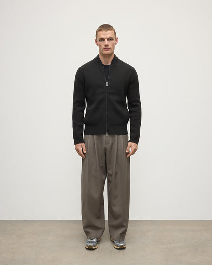 Front view model wearing Johnstons of Elgin AW25 Men's Knitwear Black Milano Ribbed Zip Black Cashmere Cardigan KAA05443SC7330