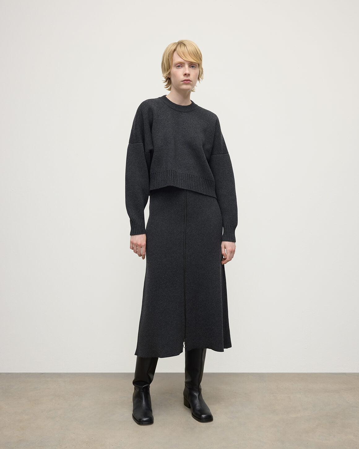 Johnstons of Elgin AW25 Model wearing Women's Knitwear Charcoal Cropped Milano Grey Cashmere Jumper Front View  KAA05488HA7165