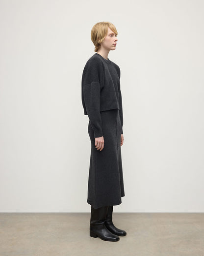 Johnstons of Elgin AW25 Model wearing Women's Knitwear Charcoal Cropped Milano Grey Cashmere Jumper Side View  KAA05488HA7165