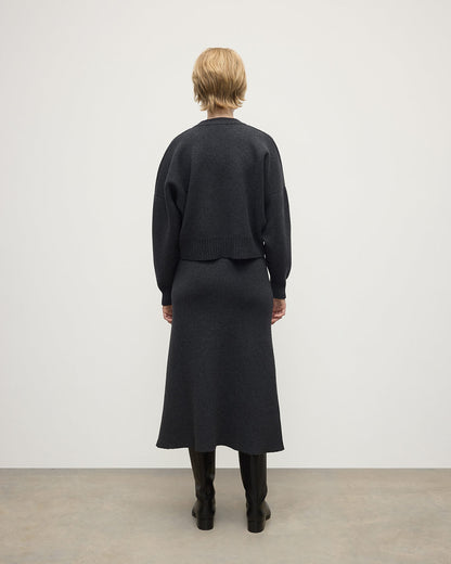 Johnstons of Elgin AW25 Model wearing Women's Knitwear Charcoal Cropped Milano Grey Cashmere Jumper Back View  KAA05488HA7165