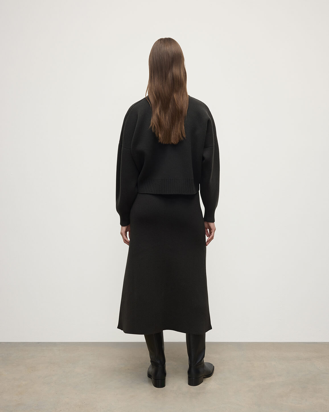 Johnstons of Elgin AW25 Model wearing Women's Knitwear Black Cropped Milano Grey Cashmere Jumper Front View  KAA05488SC7330