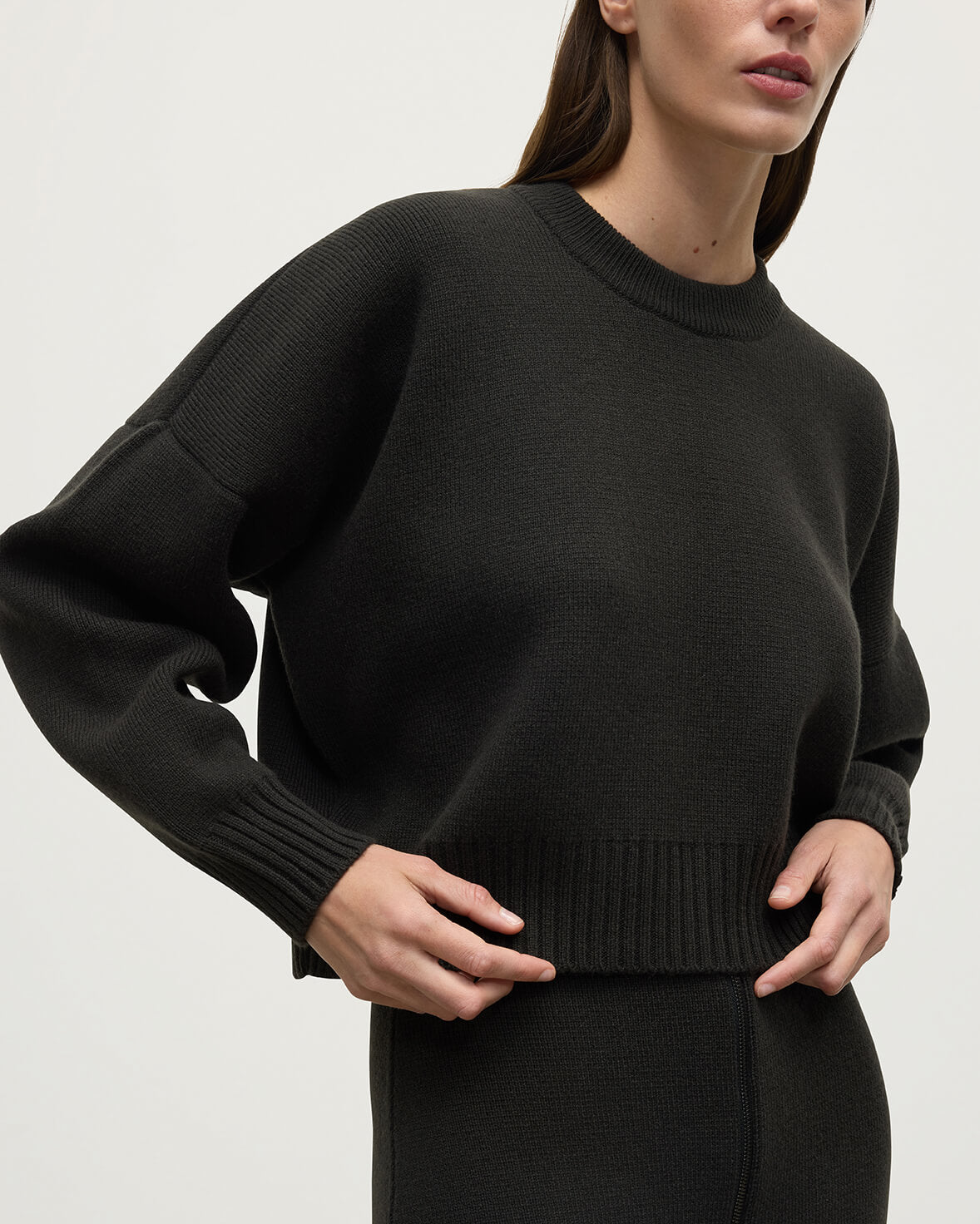 Model wearing Johnstons of Elgin AW25 Women's Knitwear Iron Cropped Milano Grey Cashmere Jumper close up KAA05488SC7330