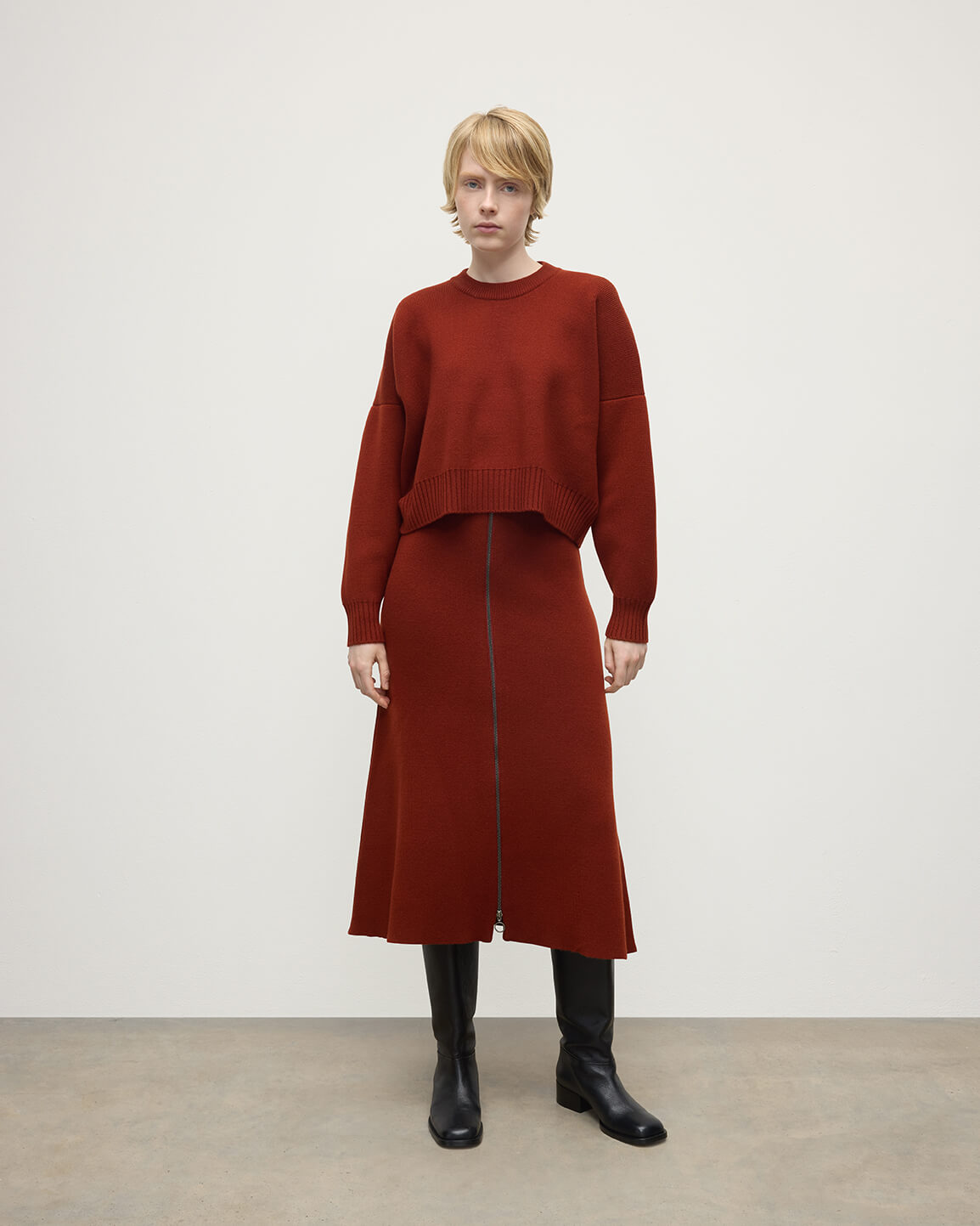 Model wearing Johnstons of Elgin AW25 Women's Knitwear Oxblood Cropped Milano Red Cashmere Jumper Front View KAA05488SG4463