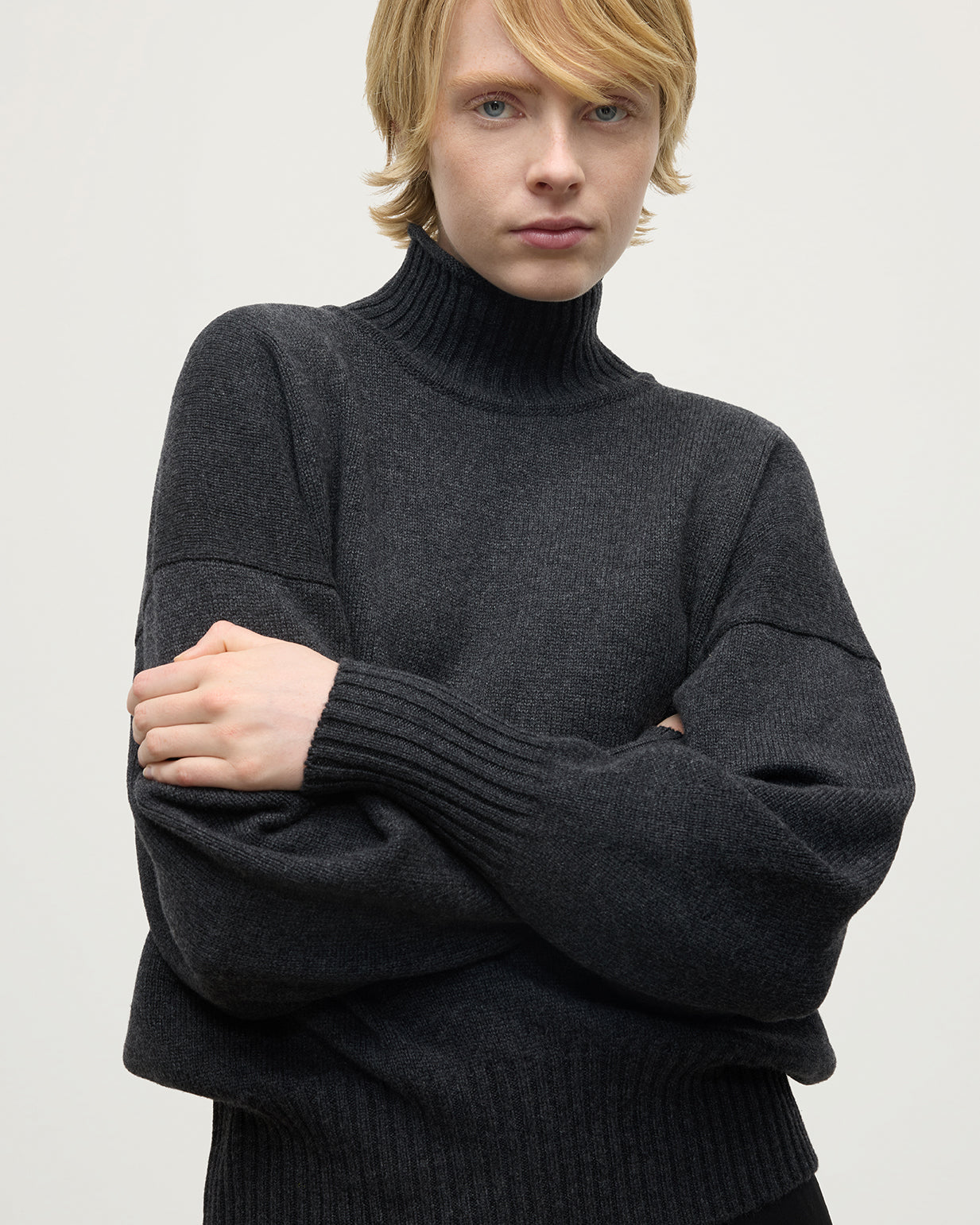 Model wearing Johnstons of Elgin AW25 Women's Knitwear Charcoal High Neck Grey Cashmere Jumper close up KAA05585HA7165