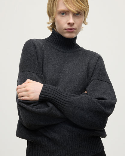 Model wearing Johnstons of Elgin AW25 Women's Knitwear Charcoal High Neck Grey Cashmere Jumper close up KAA05585HA7165