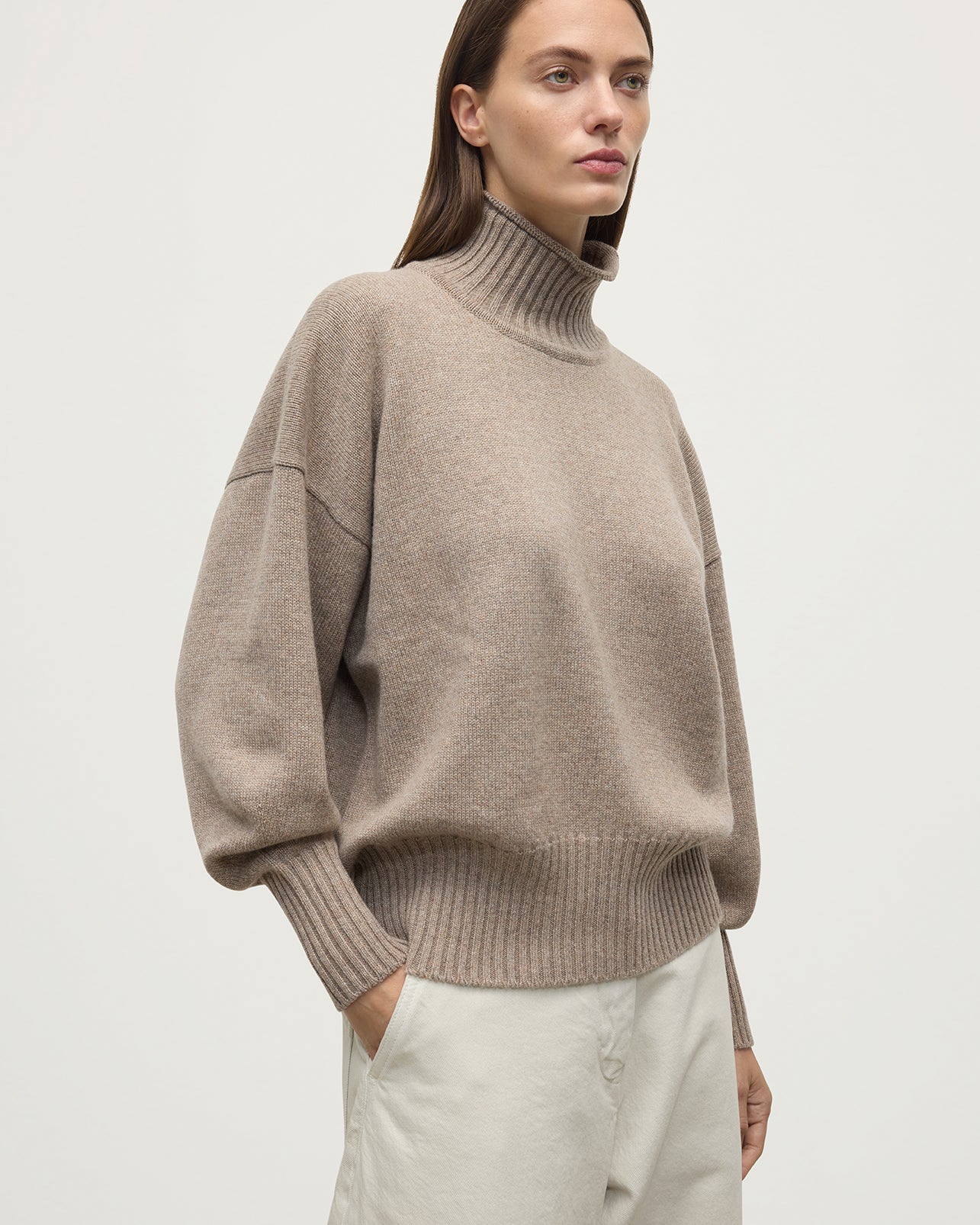 Model wearing Johnstons of Elgin AW25 Women's Knitwear Ash High Neck Brown Cashmere Jumper close up  KAA05585HB4334