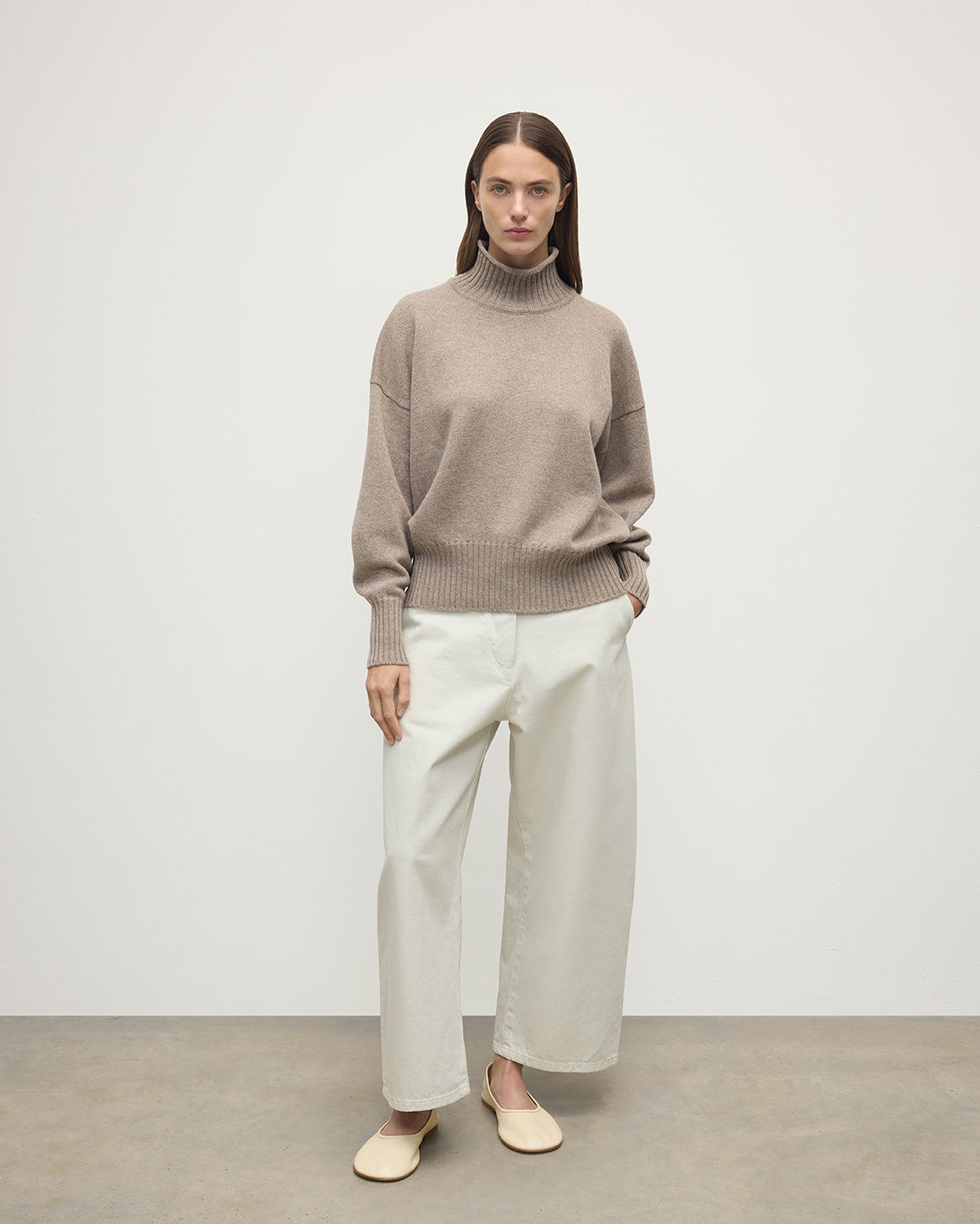 Model wearing Johnstons of Elgin AW25 Women's Knitwear Ash High Neck Brown Cashmere Jumper Front View KAA05585HB4334