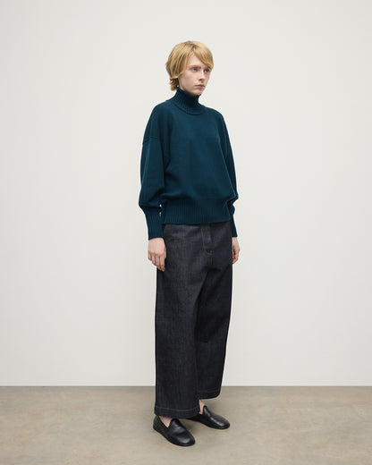 Model wearing Johnstons of Elgin AW25 Women's Knitwear Bottle Green High Neck Green Cashmere Jumper Side View KAA05585SC7341