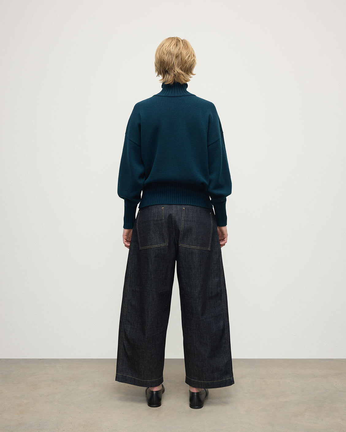 Model wearing Johnstons of Elgin AW25 Women's Knitwear Bottle Green High Neck Green Cashmere Jumper Back View KAA05585SC7341