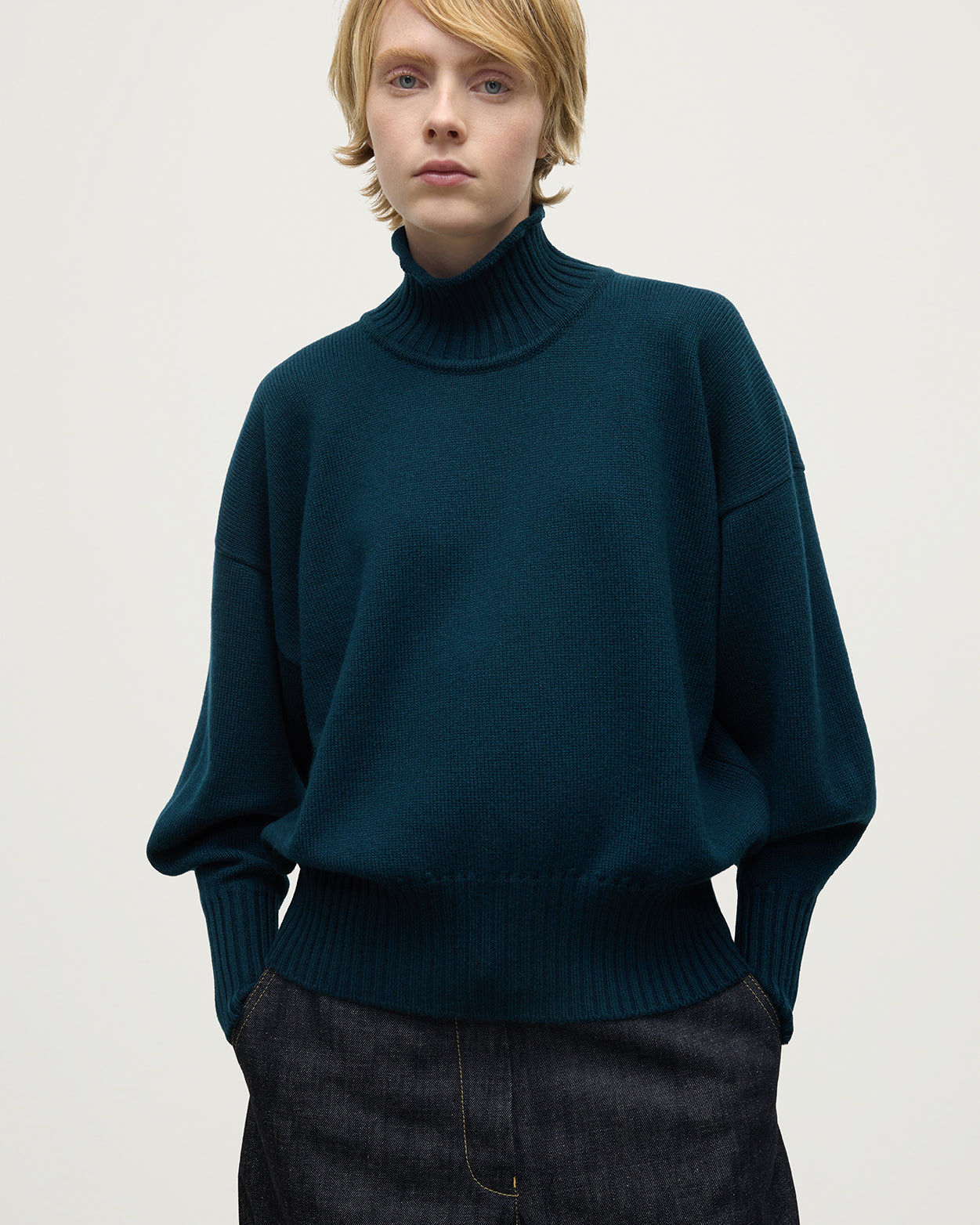 Model wearing Johnstons of Elgin AW25 Women's Knitwear Bottle Green High Neck Green Cashmere Jumper close up KAA05585SC7341