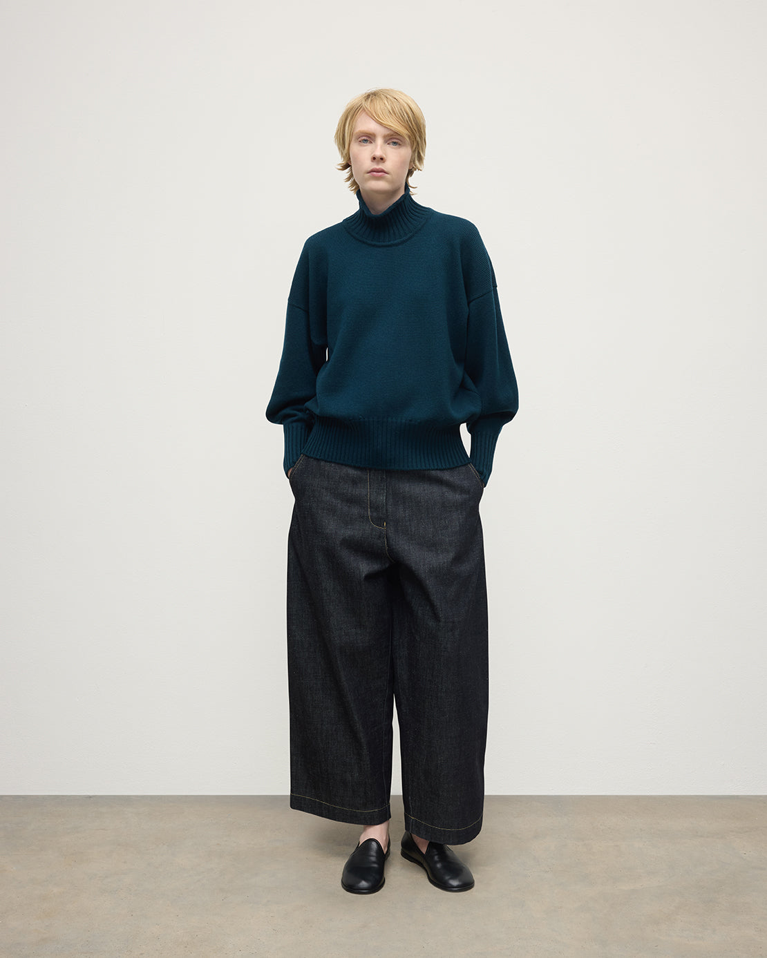 Model wearing Johnstons of Elgin AW25 Women's Knitwear Bottle Green High Neck Green Cashmere Jumper Front View KAA05585SC7341