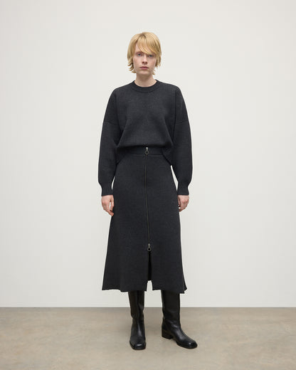 Model wearing Johnstons of Elgin AW25 Women's Knitwear Charcoal A-Line Milano Grey Cashmere Skirt Front View KAA05600HA7165