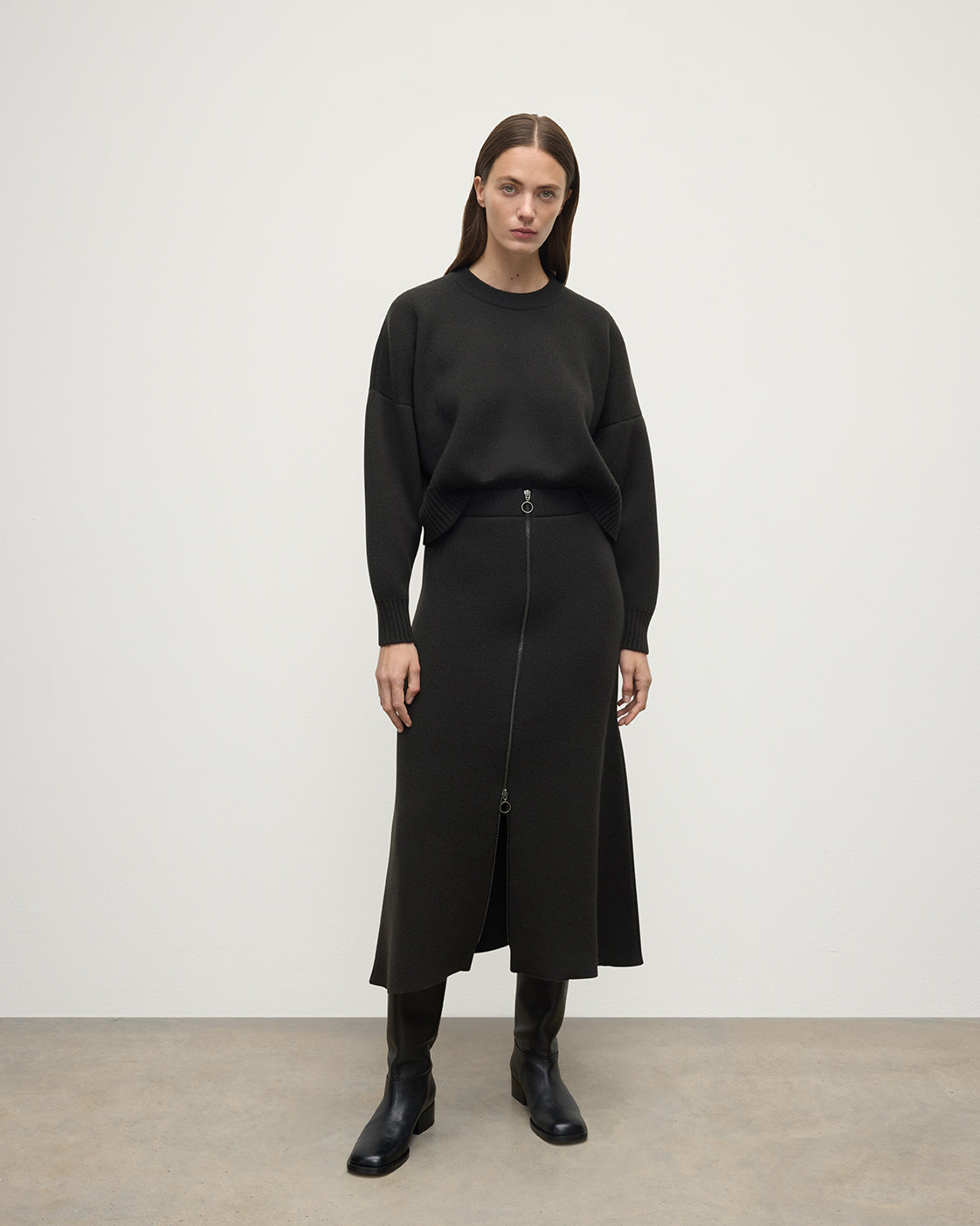 Model wearing Johnstons of Elgin AW25 Women's Knitwear Iron A-Line Milano Grey Cashmere Skirt Front View KAA05600SC7330