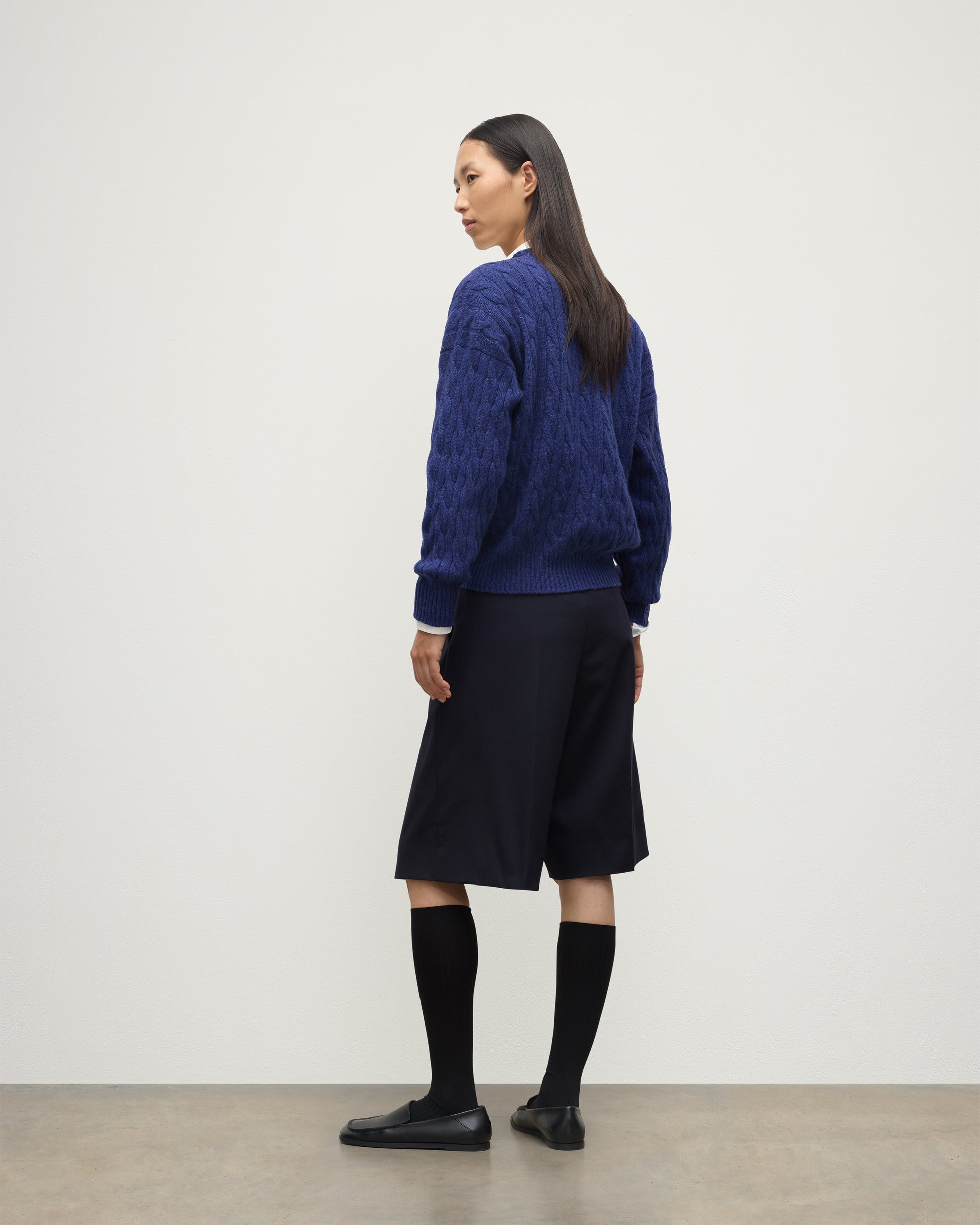 BACK OF WOMENS KYLESKU DEEP VEE SWEATER BLUE ON A MODEL KAA05728HD4490