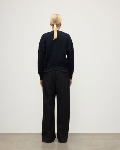 BACK OF WOMENS KYLESKU DEEP VEE SWEATER NAVY ON A MODEL KAA05728HD7347