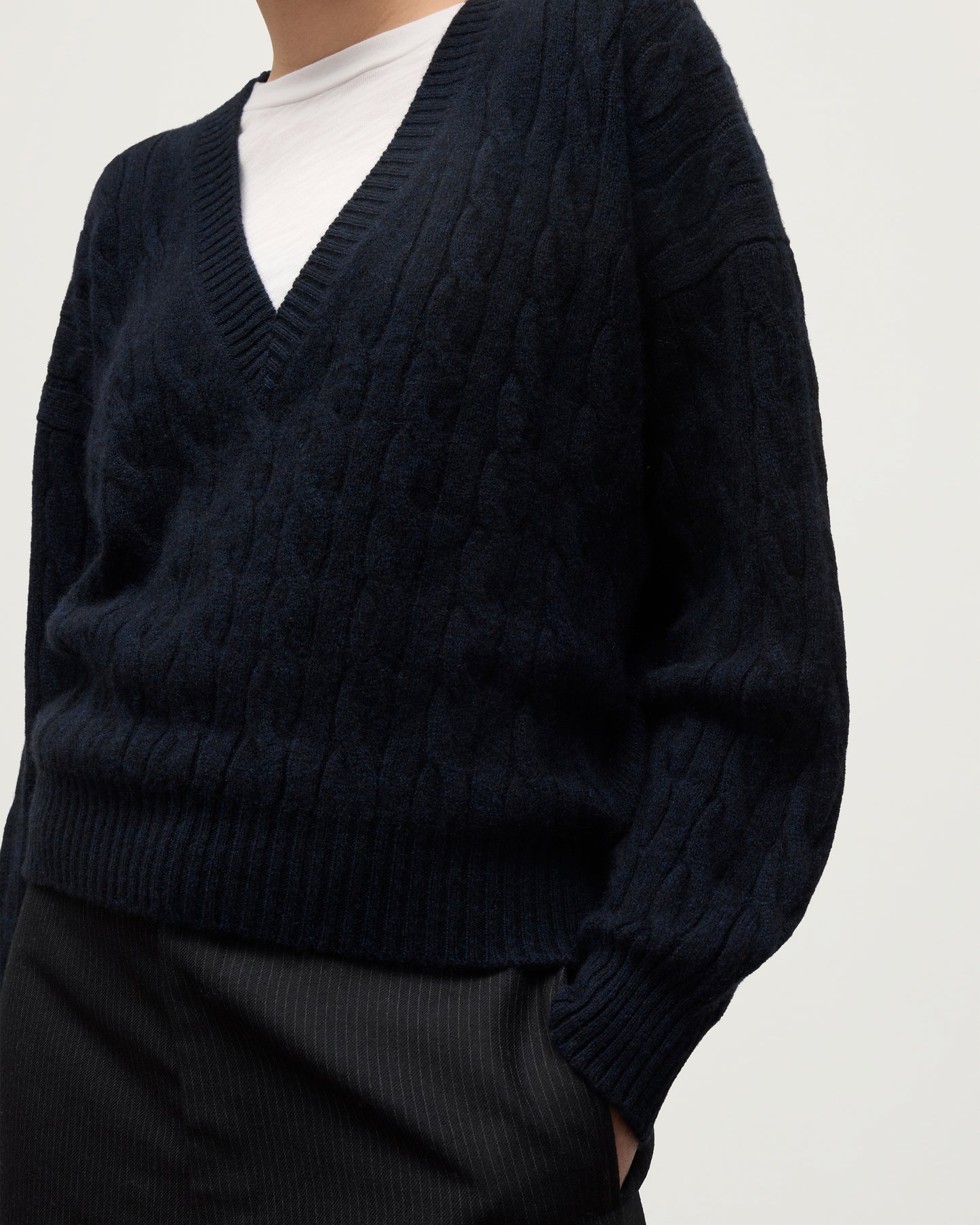 WOMENS KYLESKU DEEP VEE SWEATER NAVY ON A MODEL DETAILS KAA05728HD7347