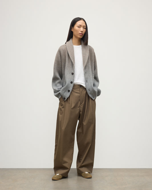 FEMALE MODEL WEARING JOHNSTONS OF ELGIN PIONEER SHAWL CARDIGAN GREY 100% CASHMERE WITH BROWN WIDE LEG CHINO, WHITE T-SHIRT & TRAINERS UAA05750Q25948