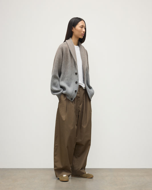 FEMALE MODEL WEARING JOHNSTONS OF ELGIN PIONEER SHAWL CARDIGAN GREY 100% CASHMERE WITH BROWN WIDE LEG CHINOS, WHITE T-SHIRT & TRAINERS UAA05750Q25948