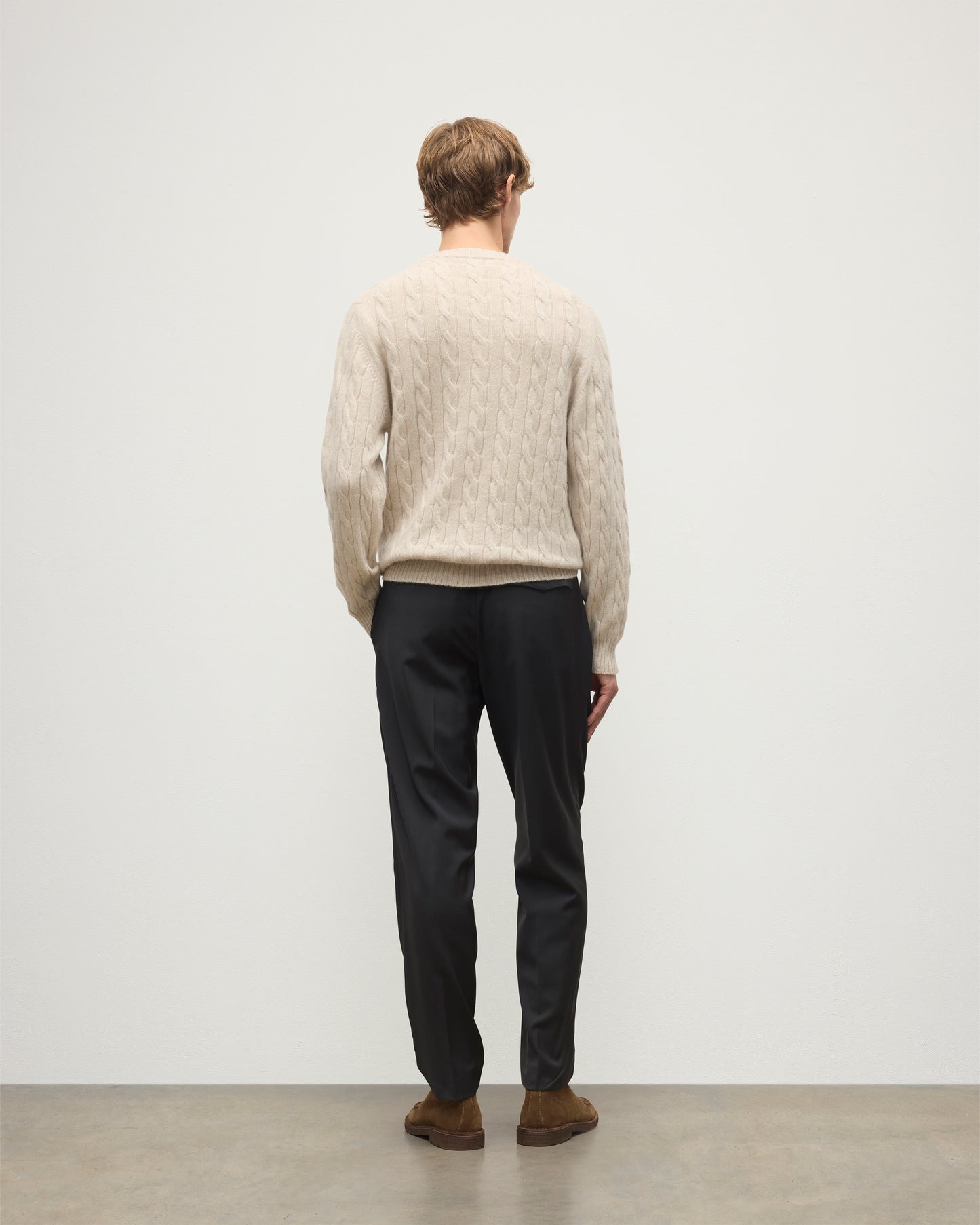 JOHNSTONS OF ELGIN MENS CALDER CREW SWEATER CREAM 100% CASHMERE WORN BY A MODEL, OVER A WHITE T-SHIRT & NAVY TROUSERS KAA05754HA0396