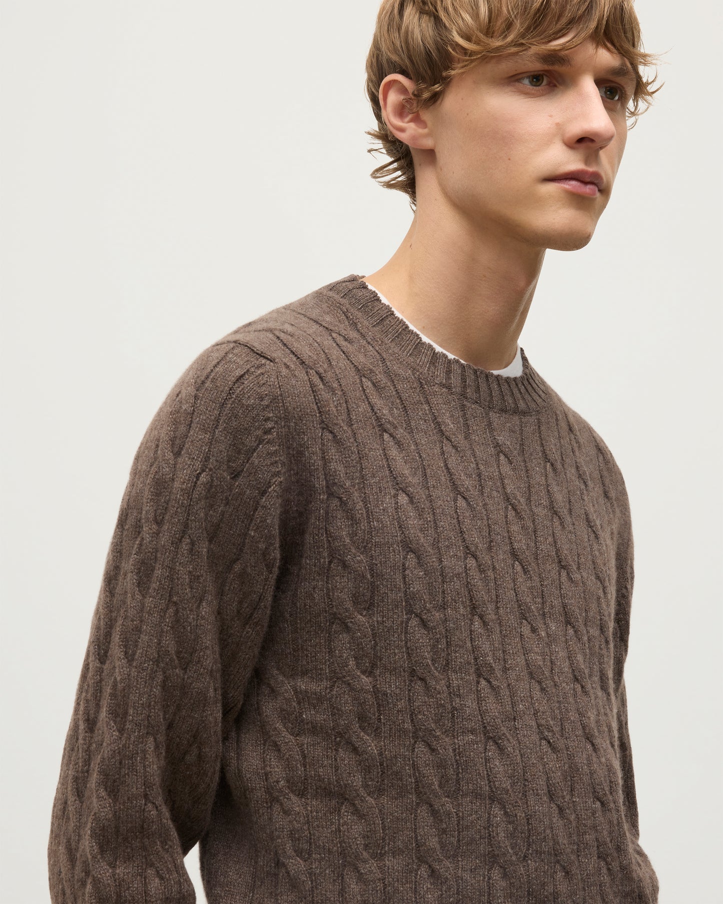 JOHNSTONS OF ELGIN MENS CALDER CREW SWEATER BROWN 100% CASHMERE WORN OVER A WHITE T-SHIRT WITH OLIVE GREEN TROUSERS KAA05754HB7126