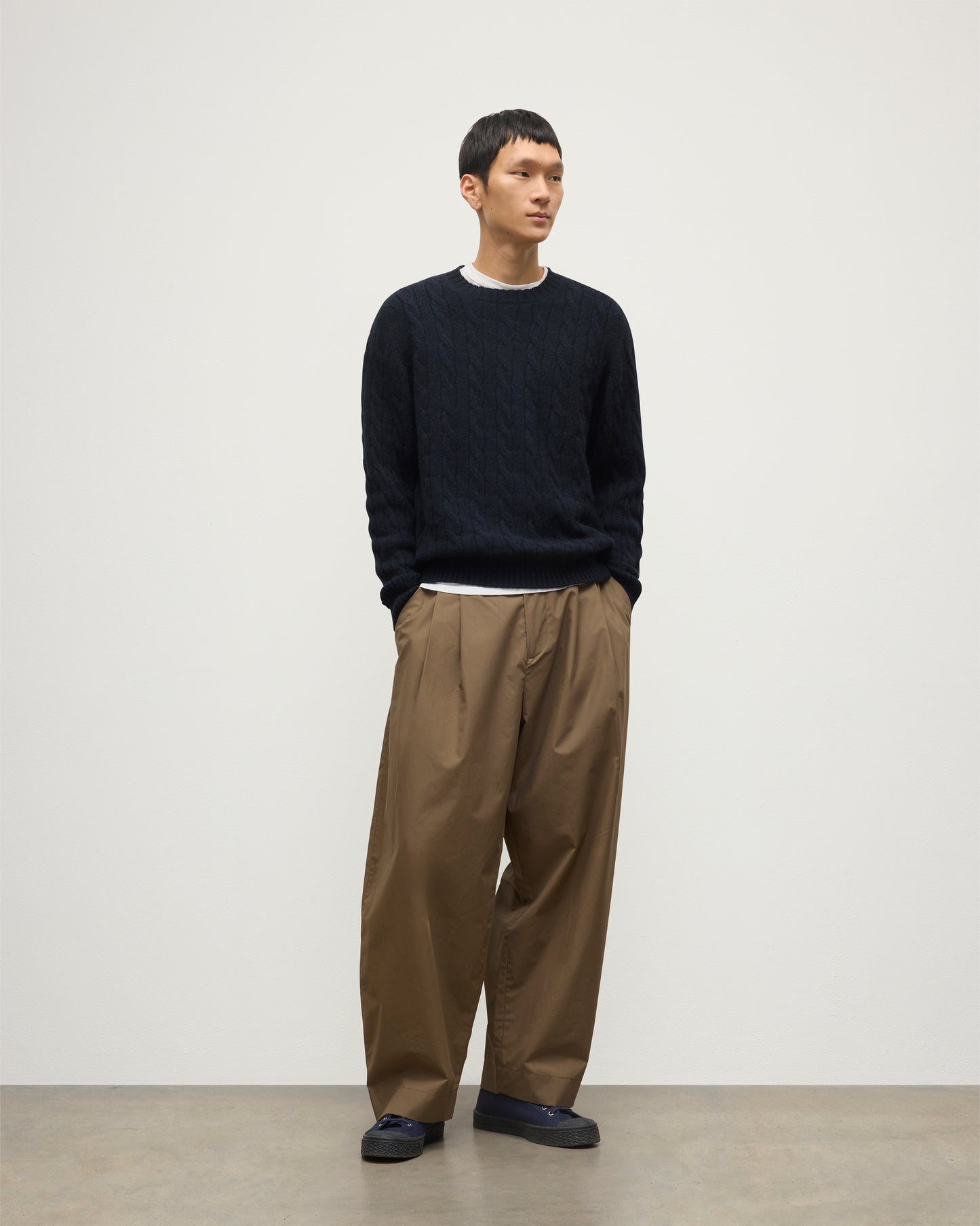 JOHNSTONS OF ELGIN MENS CALDER CREW SWEATER DARK BLUE 100% CASHMERE OVER A WHITE T-SHIRT WITH BROWN TROUSERS KAA05754HD7347