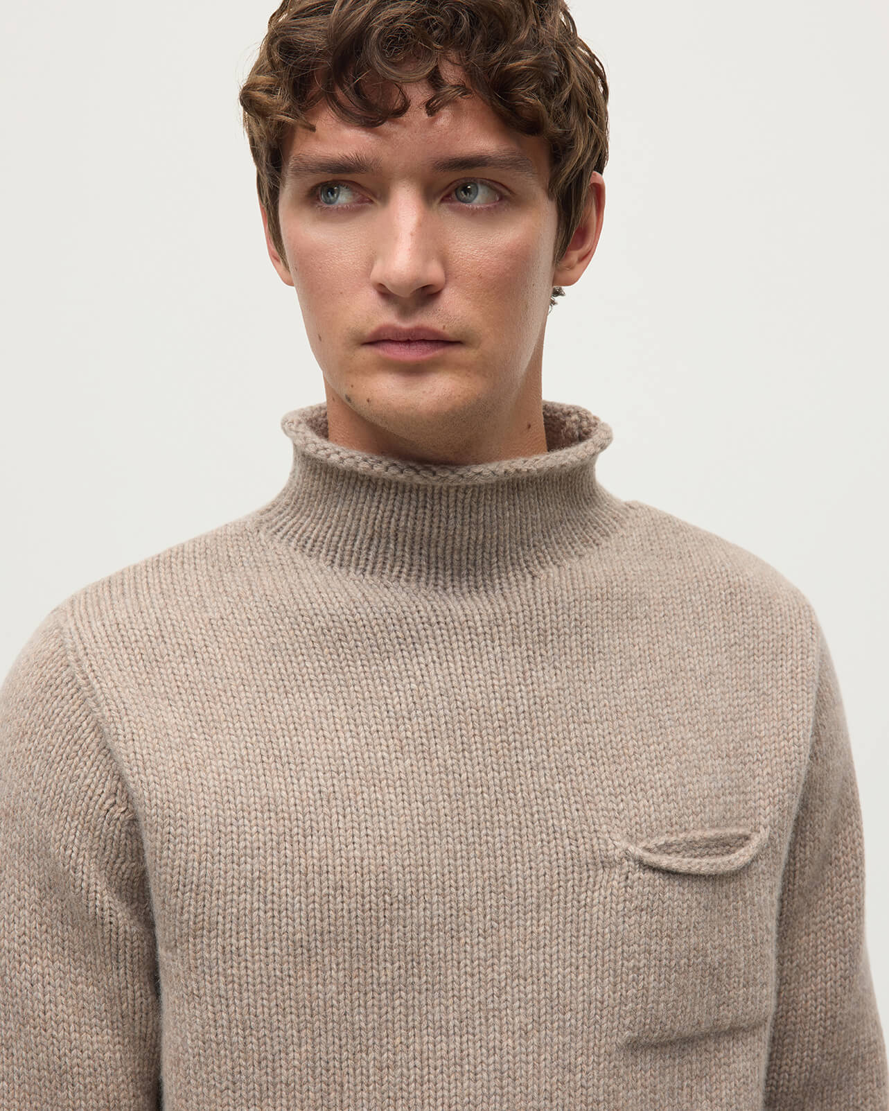 Model wearing Johnstons of Elgin Men's Knitwear Ash Brown Cashmere Turtleneck Jumper details KAB05484HB4334