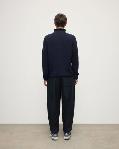 Back view of a model wearing Johnstons of Elgin  Men's Knitwear Dark Navy Navy Cashmere Turtleneck Jumper KAB05484SD7666
