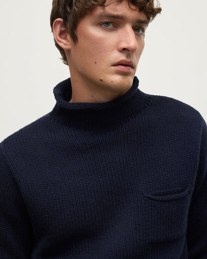 Close Up of a model wearing Johnstons of Elgin  Men's Knitwear Dark Navy Navy Cashmere Turtleneck Jumper KAB05484SD7666