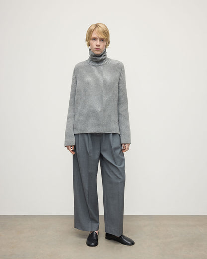 Model wears Johnstons of Elgin AW25 Women's Knitwear Light Grey Roll-Collar Grey Cashmere Jumper Front View KAB05492HA0308