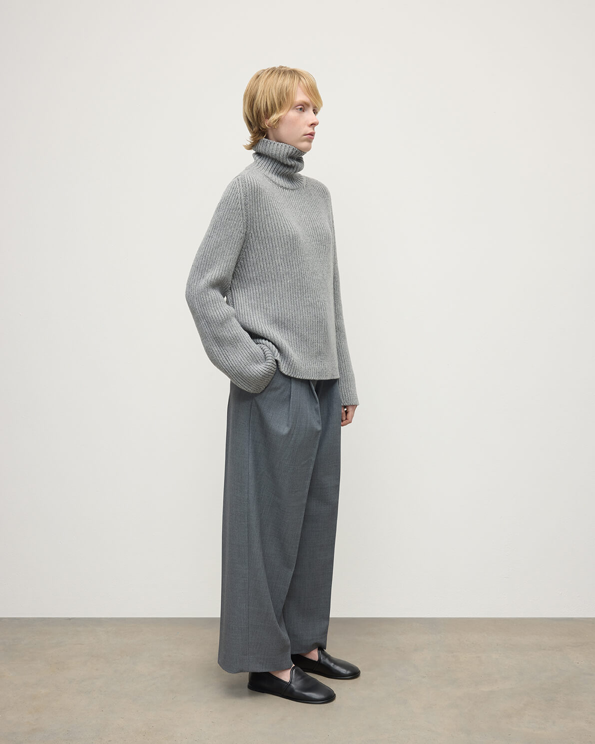 Model wears Johnstons of Elgin AW25 Women's Knitwear Light Grey Roll-Collar Grey Cashmere Jumper Side View KAB05492HA0308