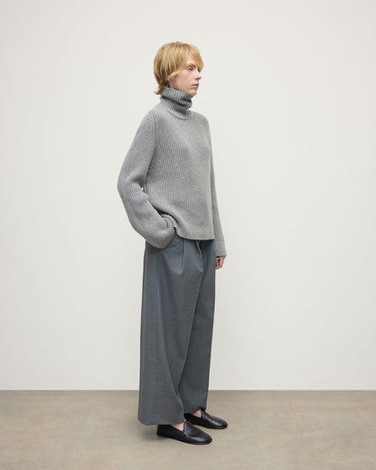 Model wears Johnstons of Elgin AW25 Women's Knitwear Light Grey Roll-Collar Grey Cashmere Jumper Side View KAB05492HA0308