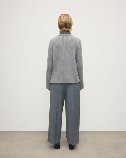 Model wears Johnstons of Elgin AW25 Women's Knitwear Light Grey Roll-Collar Grey Cashmere Jumper Back View KAB05492HA0308