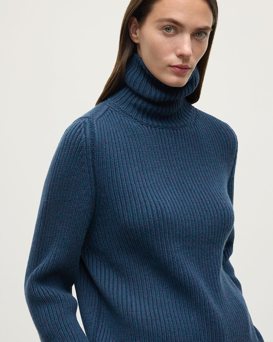 Model wears Johnstons of Elgin AW25 Women's Knitwear Heather Navy Roll-Collar Navy Cashmere Jumper close up KAB05492HD7321