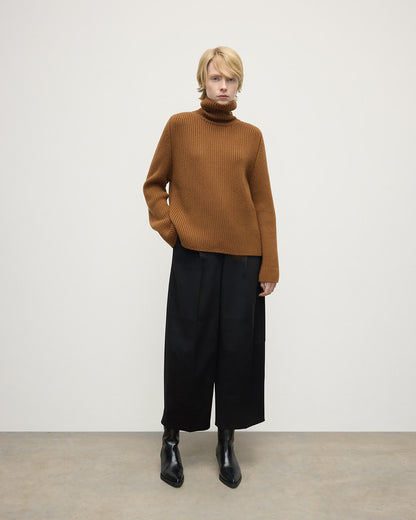 Model wearing Johnstons of Elgin AW25 Women's Knitwear Dark Camel Roll-Collar Camel Cashmere Jumper Front View KAB05492SB4620