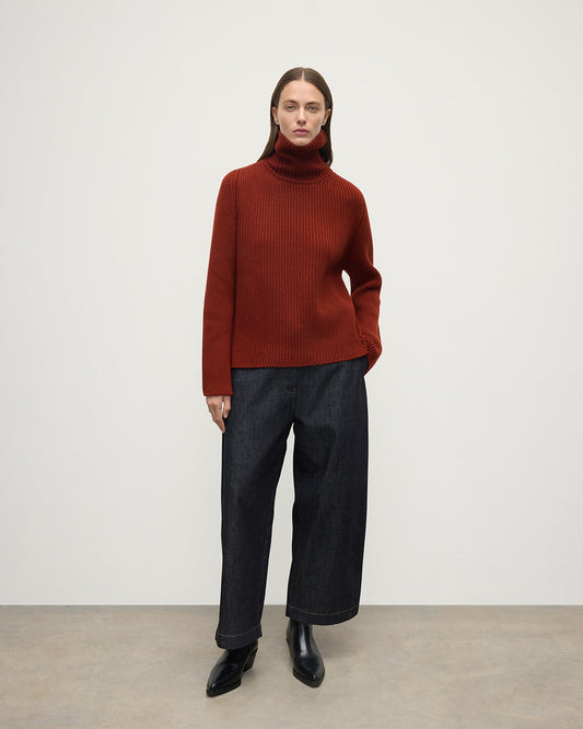 Model wears Johnstons of Elgin AW25 Women's Knitwear Oxblood Roll-Collar Red Cashmere Jumper Front View KAB05492SG4463