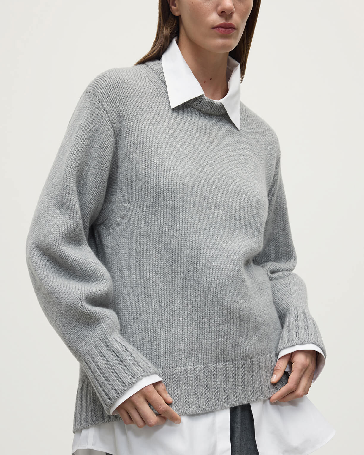 Model wearing Johnstons of Elgin AW25 Women's Knitwear Light Grey Relaxed Grey Cashmere Jumper close up KAB05562HA0308
