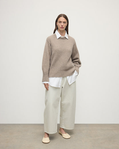 Model wears Johnstons of Elgin AW25 Women's Knitwear Ash Relaxed Brown Cashmere Jumper Front View KAB05562HB4334